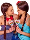 Lesbian women with heard in erotic foreplay game