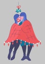 Lesbians kiss under mistletoe and hug in blanket