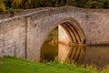 LESBURY NORTHUMBERLAND/UK - AUGUST 14 : The Old Mill Bridge at L Royalty Free Stock Photo