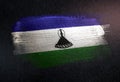 Lesotho Flag Made of Metallic Brush Paint on Grunge Dark Wall