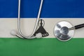 Lesotho flag and stethoscope. The concept of medicine