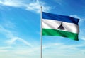Lesotho flag waving with sky on background realistic 3d illustration