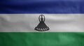 Lesotho flag waving in the wind. Close up of Sesotho banner blowing soft silk