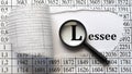 LESSEE - word behind torn paper with numbers on a white background with a magnifying glass Royalty Free Stock Photo