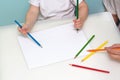 Lesson in art class. Boy drawing using color pencils Royalty Free Stock Photo