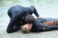 Lesson of artificial respiration. Lifeguard listening to the drowning man's breathing before giving him mouth-to Royalty Free Stock Photo