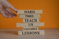 Lesson from hard times symbol. Concept words Hard times teach us valuable lessons on brick blocks Royalty Free Stock Photo