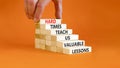 Lesson from hard times symbol. Concept words Hard times teach us valuable lessons on wooden blocks on a beautiful orange Royalty Free Stock Photo