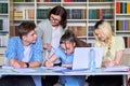 Lesson in library, high school teacher with group of teenagers Royalty Free Stock Photo