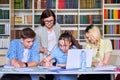 Lesson in library, high school teacher with group of teenagers Royalty Free Stock Photo