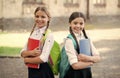 the lesson is over. Child care and happy childhood. teen schoolgirls doing homework. Children using copybooks to study Royalty Free Stock Photo