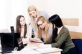 Lesson teacher school table computer business team workspace class mate group woman man room Royalty Free Stock Photo