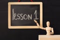 Lesson 1 written with chalk on blackboard. Royalty Free Stock Photo