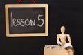 Lesson 5 written with chalk on blackboard. Royalty Free Stock Photo