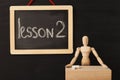 Lesson 2 written with chalk on blackboard. Royalty Free Stock Photo