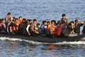 LESVOS, GREECE october 12, 2015: Refugees arriving in Greece in dingy boat from Turkey Royalty Free Stock Photo