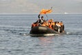 LESVOS, GREECE october 12, 2015: Refugees arriving in Greece in dingy boat from Turkey. Royalty Free Stock Photo