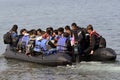 LESVOS, GREECE october 12, 2015: Refugees arriving in Greece in dingy boat from Turkey. Royalty Free Stock Photo