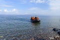 LESVOS, GREECE october 12, 2015: Refugees arriving in Greece in dingy boat from Turkey. Royalty Free Stock Photo