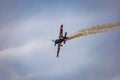 Antidotum Airshow Leszno 2023 and acrobatic shows full of smoke of Ãâ°quipe de Voltige on blue