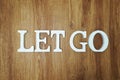 Let Go word alphabet letters on wooden background Royalty Free Stock Photo