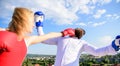 Let her win concept. Couple boxing gloves fight sky background. Leadership family relations. Things guy can do to make Royalty Free Stock Photo