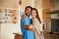 Let love lead. Cropped portrait of an affectionate young couple dancing in their kitchen.