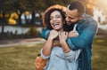 Let love prosper on. an affectionate young couple bonding together outdoors. Royalty Free Stock Photo