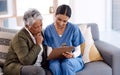 Let me help you make sense of this...a young nurse going through paperwork with a senior woman.