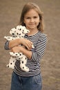 Let me play with you. Little kid cuddle toy dog outdoors. Toy friend. Childhood friend and friendship. Fun and game Royalty Free Stock Photo