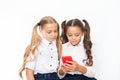 Let me show you something interesting. Educational application. Online entertainment concept. Schoolgirls cute pupils