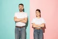 Let me think. Doubtful pensive couple with thoughtful expression making choice against pink background Royalty Free Stock Photo