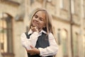 Let me think. Little kid lost in thoughts outdoors. Thoughtful look of small girl. Personal learning and thinking skills Royalty Free Stock Photo