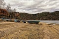 Let-out lake shore with boat and mole laying in the sand Royalty Free Stock Photo