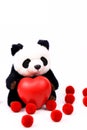 Panda Push Doll Embracing a red heart