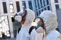 Let`s clean, disinfect this places. two cleaners in suits work together Royalty Free Stock Photo