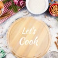 Let`s cook quote with cutting coard, rolling pin, ingredients in background Royalty Free Stock Photo