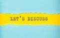 LET`S DISCUSS text on the torn paper , yellow background Royalty Free Stock Photo