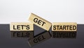 Let`s get started text on wood block and black and white background. business concept Royalty Free Stock Photo