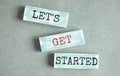 Let`s get started text on wooden block, business