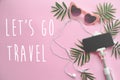 Let`s go Travel text on stylish pink sunglasses, phone on selfie Royalty Free Stock Photo