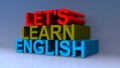 Let`s learn english on blue Royalty Free Stock Photo