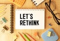 Let's Rethink text on notepad, concept background Royalty Free Stock Photo