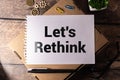Let's Rethink text on notepad, concept background Royalty Free Stock Photo