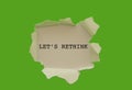 LET`S RETHINK word written under torn paper. Royalty Free Stock Photo