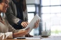 Let technology help simplify your workload. two colleagues working together on a digital tablet in an office. Royalty Free Stock Photo