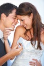 Let them eat cake. Fun shot of two young newlyweds feeding each other wedding cake. Royalty Free Stock Photo