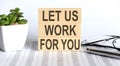 Let Us Work For You - words from wooden blocks with letters, the time is now concept Royalty Free Stock Photo