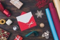 Let us write letter to the North Pole. Top above high angle close up view photo of open red envelope with white card Royalty Free Stock Photo