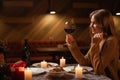 Let& x27;s have a toast concept. Romantic dinner at restaurant or home. Young couple in love celebrating Valentines day Royalty Free Stock Photo